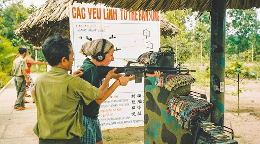 Tourists experience shooting activities at the tunnels