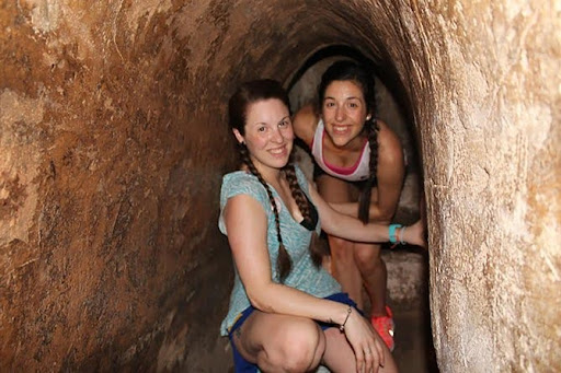 Tourists are fascinated by walking through the Cu Chi Tunnels