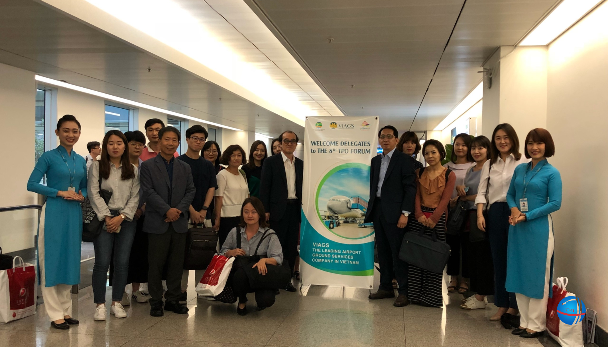 Tan Hung Thai Travel staff assisting customers at Noi Bai Airport.